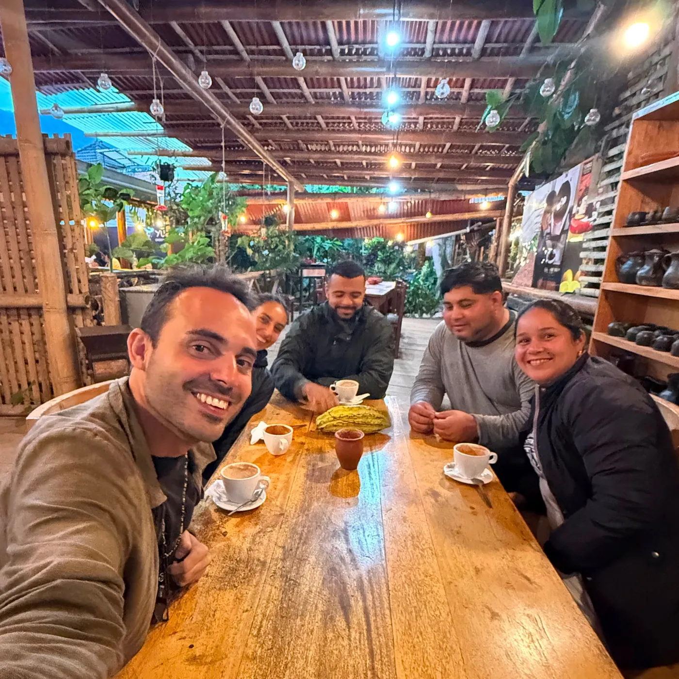 Natasha with friends around a café table