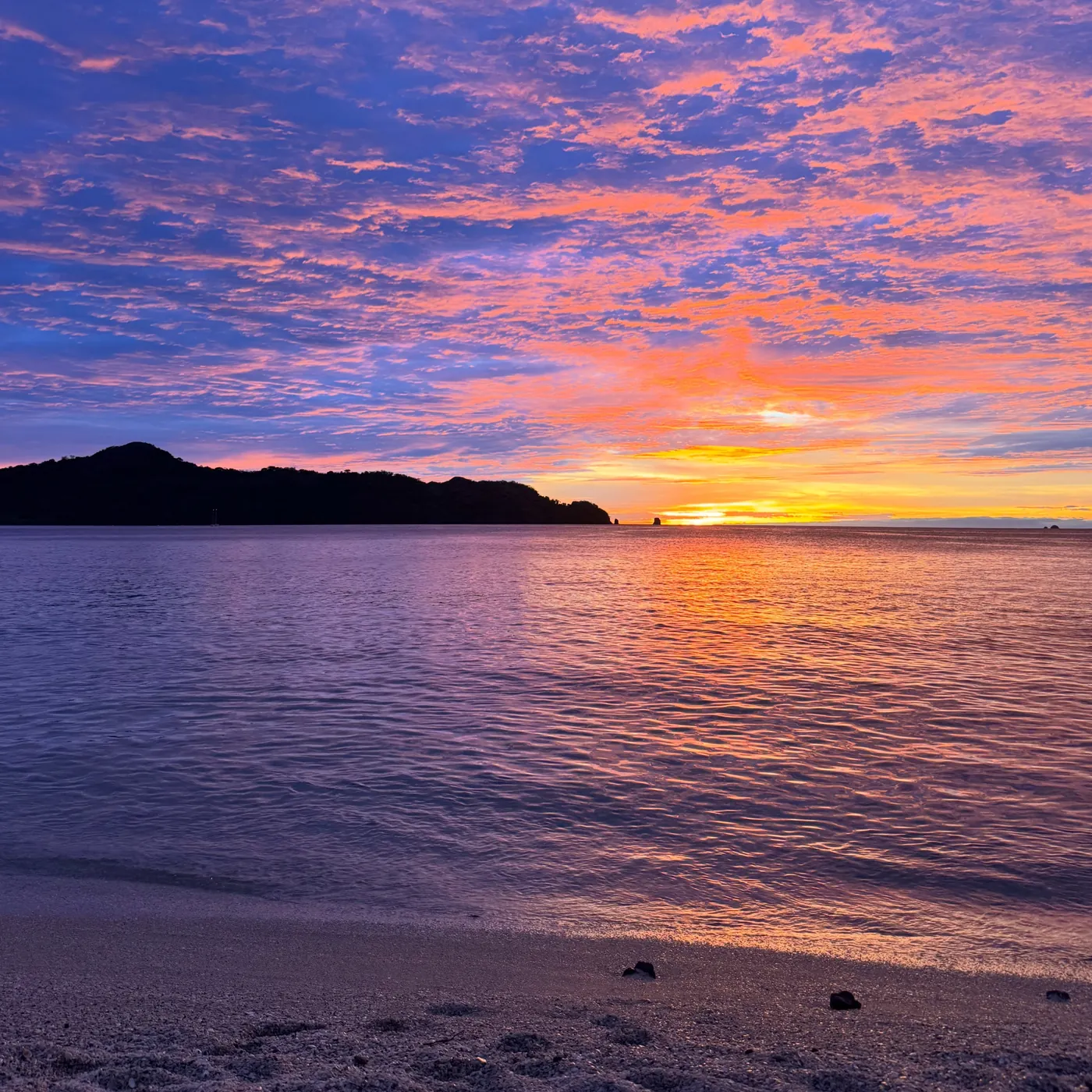 A pink and orange sunset over the sea, Costa Rica
