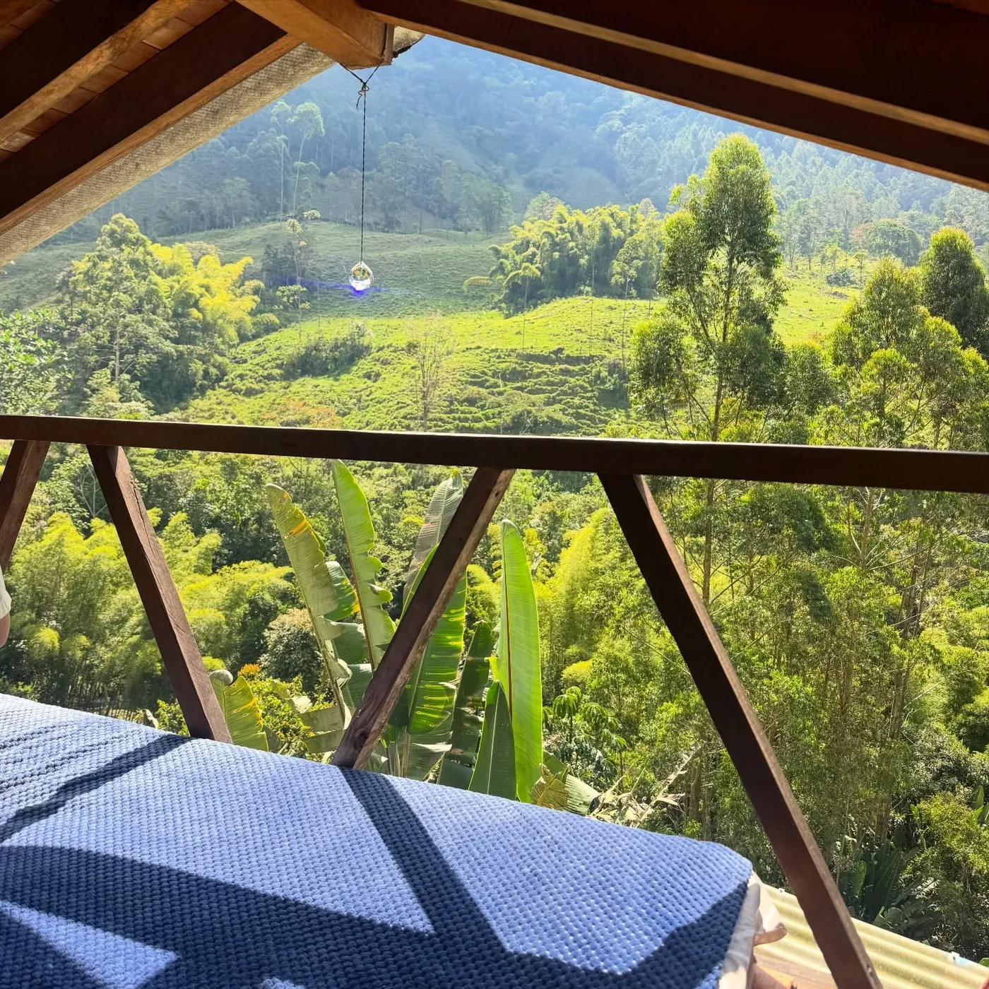 A wooden balcony over green mountains, Jardín