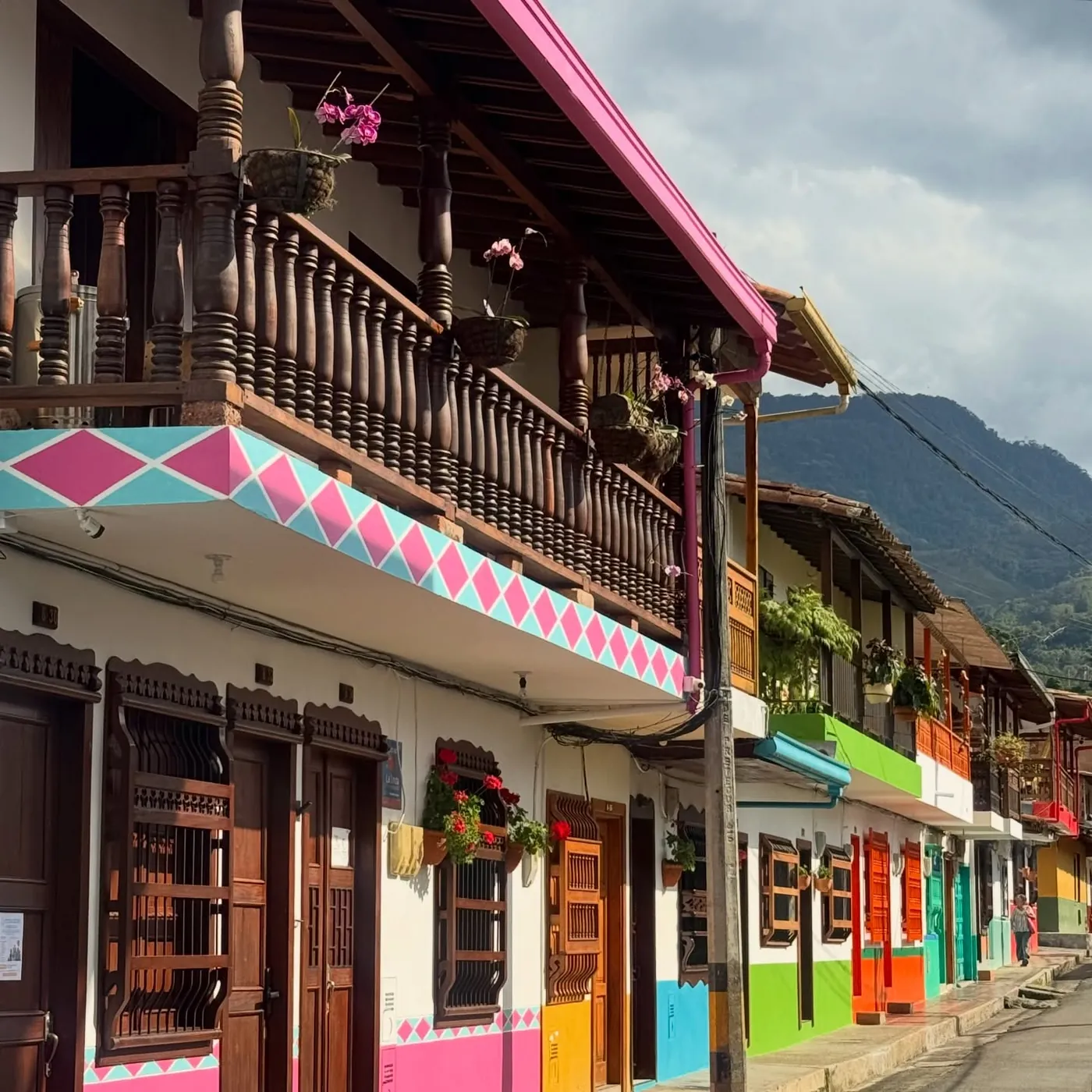 Colourful balconies in pink, green and yellow, Jardín