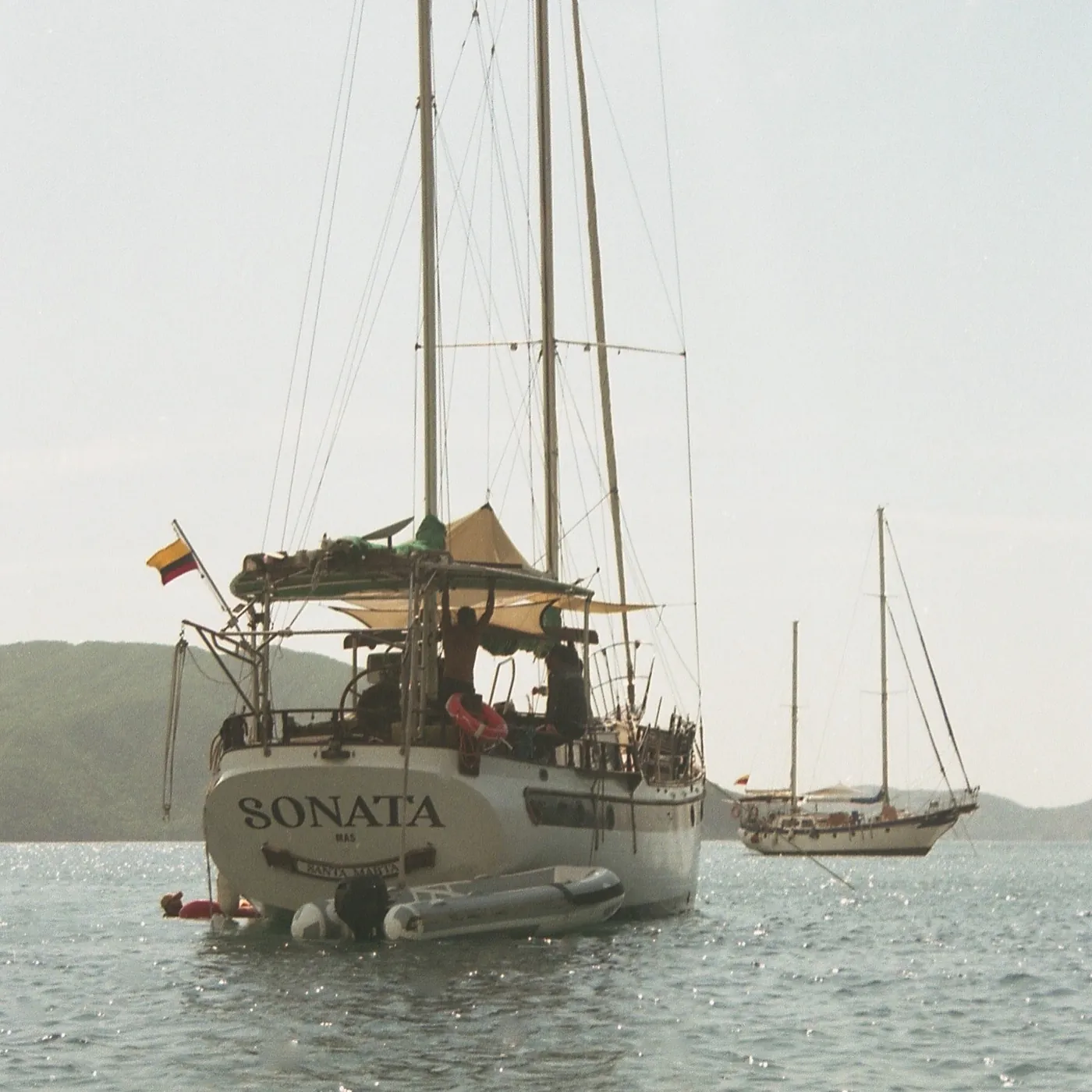 A white sailboat on a grey sea, Colombia