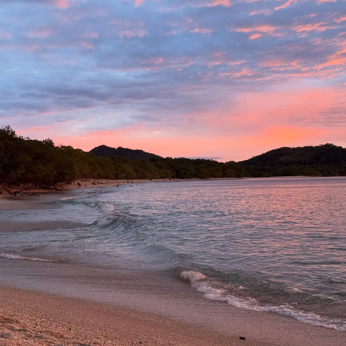 A pink sunset over a beach, Tamarindo
